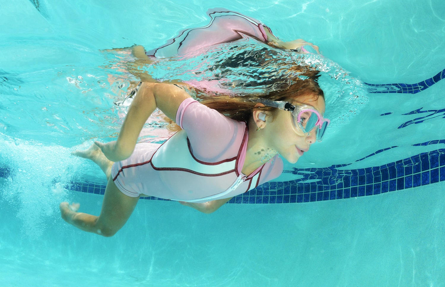 cute kid swimming in pool cute kid swimming in pool